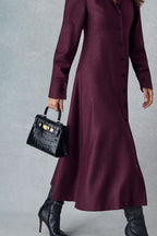 Lalage Beaumont Eleanor dress in burgundy donegal tweed with maya midi black orinoco, model shoot side