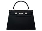 A black Maya Large Italian leather handbag with a pebble print, featuring a top handle, detachable strap and silver colored hardware.