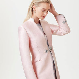 Pale pink silk coat with silver embroidered trimming and frogging fastening