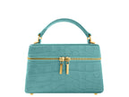Ninette Orinoco Topaz Handbag with gold accents on a white background