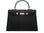 A black Maya Grande Dolomite handbag with gold plated hardware and a pebble print texture, featuring a top handle, detachable strap and gold accents.