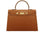 A large tan colored Italian calf leather handbag with pebble print texture, gold plated hardware, and a top handle with a detachable strap.