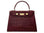 A large wine ‘croc’ print Italian calf leather handbag with top handle, detachable strap and gold plated hardware with magnetic fastening.