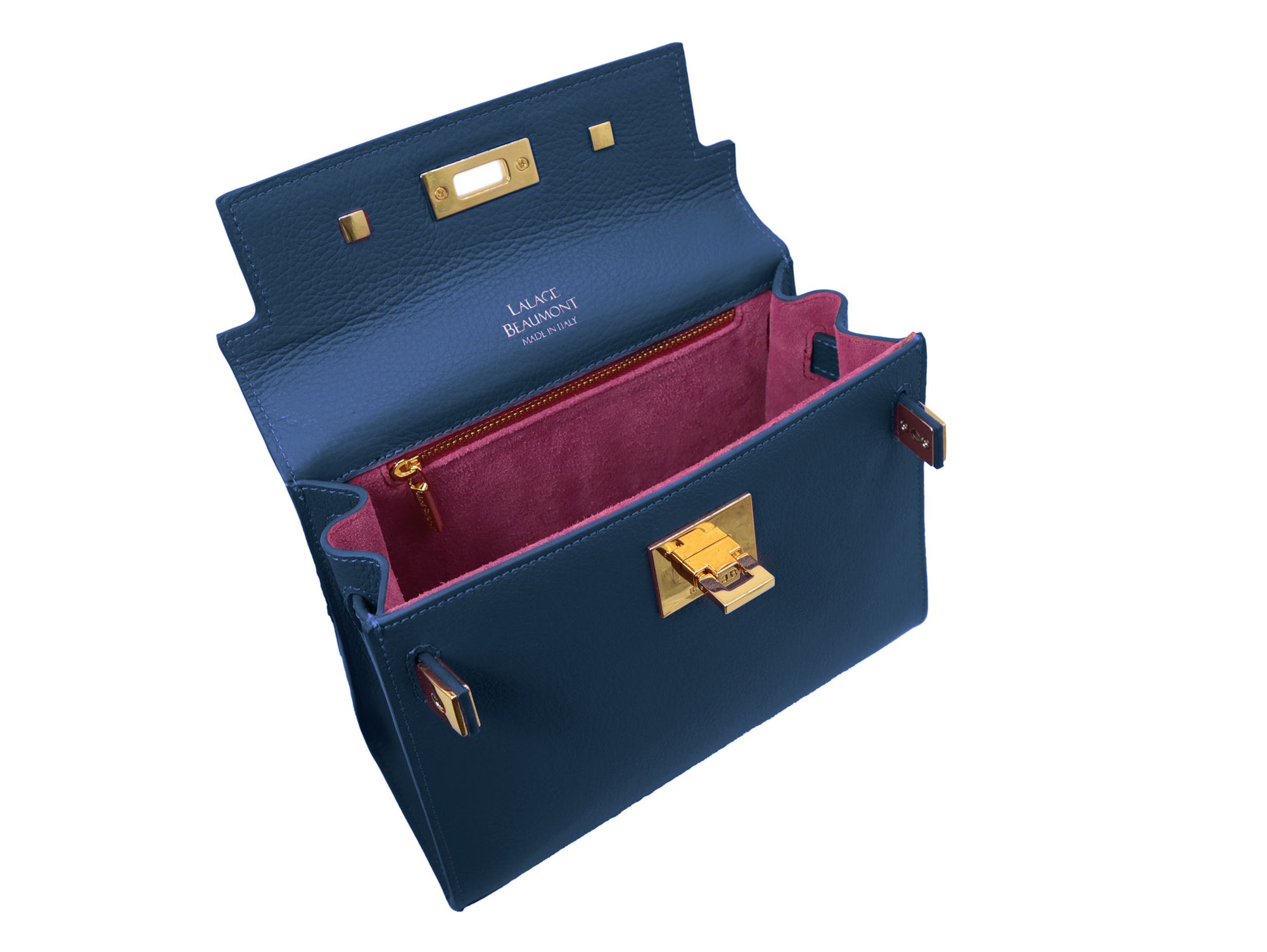 Interior of a navy blue Italian leather handbag with gold hardware, a top handle and a detachable strap showing the pink suede interior on a white background