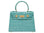 A turquoise 'Croc' print Italian calf leather handbag with gold plated hardware and a top handle.
