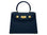 Navy blue Italian leather handbag with gold hardware, a top handle and a detachable strap on a white background
