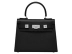 A black, medium-sized Italian leather handbag with a pebble print and silver hardware, featuring a top handle and a detachable shoulder strap.