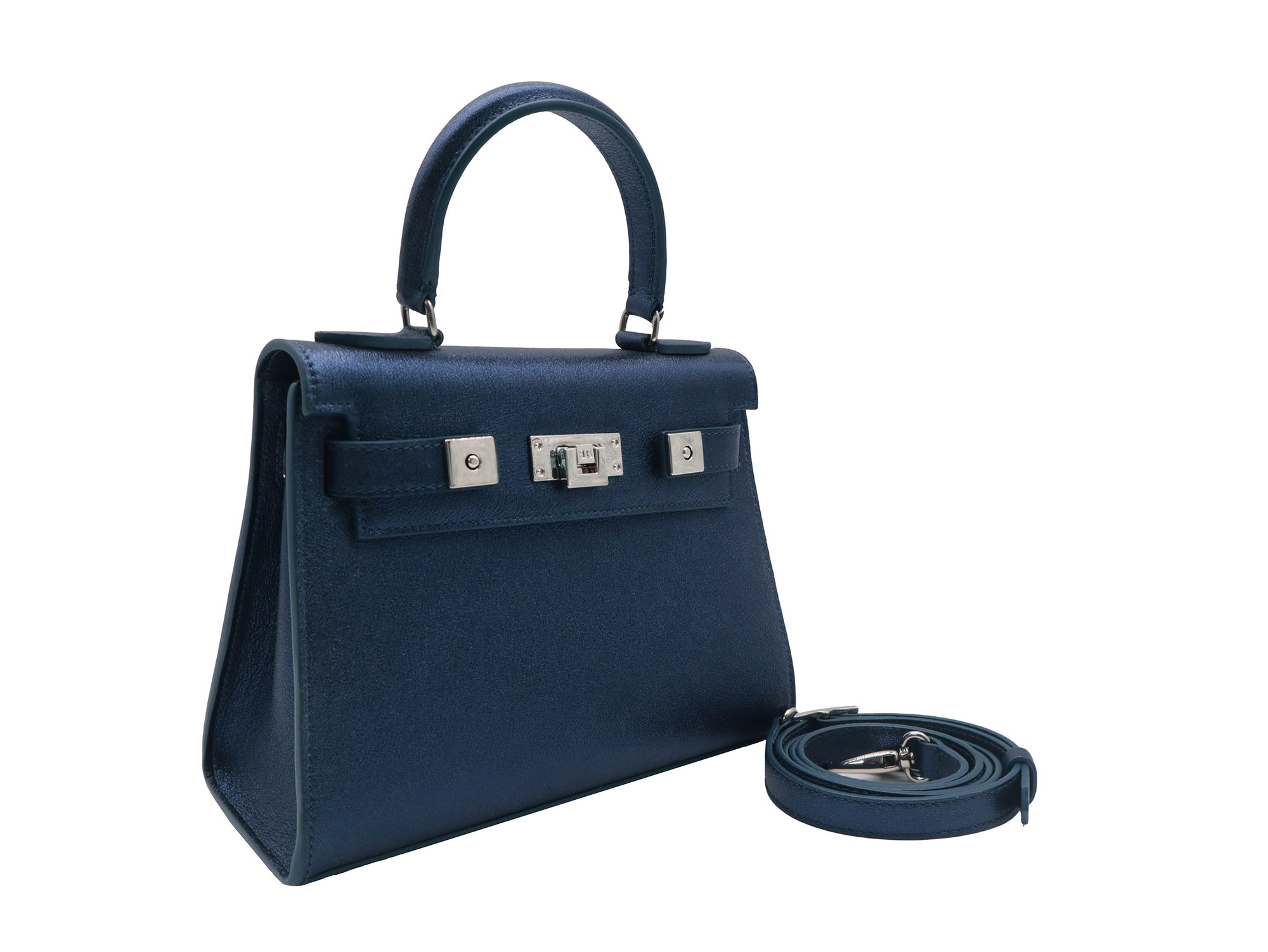 Medium navy blue natural grain Italian leather handbag with a hint of silver sparkle  with silver hardware, a top handle and a detachable strap on a white background
