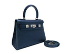 Medium navy blue natural grain Italian leather handbag with a hint of silver sparkle  with silver hardware, a top handle and a detachable strap on a white background